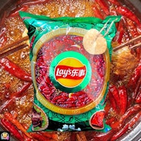 a bag of chili peppers in a pot